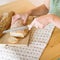 Background of a woman slicing bread