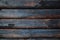 Background from wooden logs of charred brown-black color