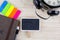 Background with wooden signage for text, alarm clock, sticky paper and diary on desk