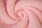 Background of woolen knitted pink warm sweater top view