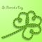 Background with the words St. Patricks Day. Clover with three petals of green folded rope.