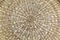 Background - a woven spiral circle with a straw texture.