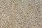 Backgrounds of sand stone wall. Small pebbles mixed with sand texted background