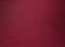 Backgrounds and textures. Maroon knitted fabric. Fine knit