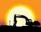 Backhoe with big yellow sunset