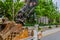 Backhoe buckets in back of truck on residential street