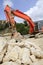 Backhoe bulldozer working hard with stones