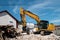 Backhoe in the demolition of a house