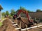 A backhoe digging a hole for a pool behind a house in Orlando, Florida