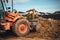 Backhoe loader close up. Portrait of engineer leveling earth and soil in garden for landscaping