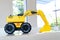 Backhoe loader, yellow construction toy vehicle with articulated parts built with sturdy plastic is placed on a table
