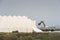 Backhoe loading sea salt in a truck