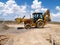 Backhoe Shoveling Gravel