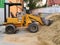 The backhoe is used for loading rocks, soil or sand in construction or agriculture work.