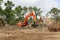 Backhoes Clearing Land