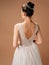 Backless wedding dress. Gorgeous sleeveless bridal gown with tender french lace and beads, long lush tulle skirt. Beautiful brunet