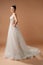 Backless wedding dress. Gorgeous sleeveless bridal gown with tender french lace and beads, long lush tulle skirt. Happy brunette l