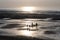 Backlight image of people on a beach