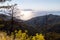 Backlight image from the westcoast of Greek island Rhodes with yellow plants, trees and forest in the foreground and the aegaen