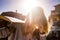 Backlight portrait for blonde girl with skateboard