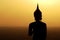 Backlight silhouette of Buddha statues in the temple.-