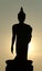 Backlight silhouette of Buddha statues in the temple.-