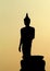 Backlight silhouette of Buddha statues in the temple.-