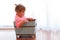 Backlit baby in wooden box