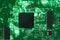 Backlit green printed circuit board background texture