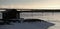 Backlit image of fishing hut and bridge at Lake Storsjon in Jamtland, Sweden