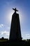 Backlit image with the silhouette of the famous Cristo-Rei or King-Christ Sanctuary in Almada.