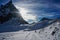 Backlit mountains winter with snow panorama landscape