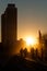 Backlit people walking at Port Olimpic, Barcelona.