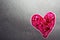 Backlit Pink Textured Heart on Gray Background