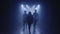 Backlit silhouettes of singer vocalist girl, saxophonist sax, dj man with headphones walking forward