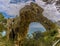 A backlit view of the elephant-shaped, natural arch on the island of Capri, Italy