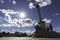 Backlit view of Millennium Monument in Hosok Square, where the contrast of sunlight and sky with the monument is contemplated