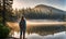 Backpack-adorned girl standing at edge of serene mountain lake