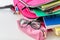 Backpack, apple and school supplies on table