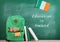 backpack, blackboard with text & x22;Education in Ireland& x22;, flag of the Ireland, books and notebooks