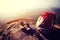 Backpack, boots and sticks on mountain peak cliff