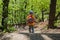 Backpack child hiking summer green. cheerful