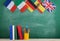 backpack, flags of Spain, France, Great Britain and other countries, books and school supplies of the blackboard