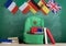 backpack, flags of Spain, France, Great Britain and other countries, books and school supplies of the blackboard