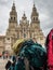 Backpack of pilgrim with the Santiago de Compostela Cathedral in the Obradoiro square in Santiago de Compostela