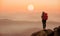 Backpack woman standing on the hill with beautiful nature