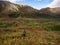 Backpacker in Autumn Tundra of Alaska, Mountain Valley