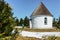 Backpacker at baroque Chapel of the Visitation of the Virgin Mary,Kunstat Chapel, located in Eagle Mountains at altitude of 1035 m