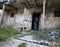 backpacker enters the old abandoned stable in northern Italy at