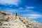 Backpacker exploring the majestic Inca Trails on Island of the Sun, Titicaca Lake, among the most scenic travel destination in Bol